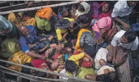  ?? EPA; AFP ?? UN High Commission­er for Human Rights Michelle Bachelet said Myanmar’s security forces were afforded total impunity. Left, Rohingya refugees arriving by boat at Shah Parir Dwip on the Bangladesh side of the Naf River after fleeing violence in Myanmar