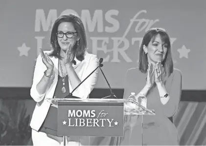  ?? MIKE LANG/SARASOTA HERALD-TRIBUNE FILE ?? Moms for Liberty was founded in Florida by Tiffany Justice, left, Tina Descovich, right, and Bridget Ziegler, not pictured.