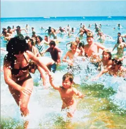  ?? AP ?? Beach-goers run from the water in a scene from the 1975 film “Jaws.”