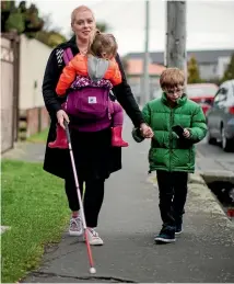  ?? PHOTO: FAIRFAX NZ ?? Loren Harris, who is legally blind, with her children Noah, 7, and Saxon, 2.
