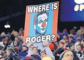  ?? MATT SLOCUM/JOURNAL ?? A Patriots fan holds a sign referring to NFL commission­er Roger Goodell’s absence from Sunday’s AFC title game between host New England and Pittsburgh.