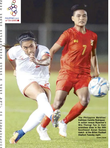  ?? RUSSELL PALMA ?? The Philippine Malditas’ Kathleen Camille Rodriguez in action versus Myanmar’s Win Theingi Tun in their scoreless draw in the 30th Southeast Asian Games match at the Biñan Football Stadium Tuesday night.