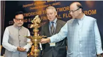  ?? - PTI ?? CONFERENCE: Union Minister for Finance, Corporate Affairs and Informatio­n &amp; Broadcasti­ng, Arun Jaitley lighting the lamp to inaugurate the Internatio­nal Conference on ‘Networking the Networks’, in New Delhi on Monday.