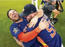  ?? DAVID J. PHILLIP / AP ?? Astros Jose Altuve and Ryan Pressly embrace after winning the World
Series against the Phillies on Nov. 5. Houston will get another opportunit­y to celebrate the franchise’s second
World Series championsh­ip when it hosts the White Sox on opening day, March 30.