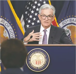  ?? KEVIN LAMARQUE/ REUTERS ?? Most economists believe a recession is imminent after U.S. Fed chairman Jerome Powell, pictured, on Wednesday boosted the benchmark short-term rate to the highest level since early 2008.