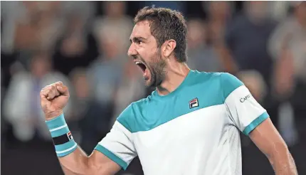  ?? LUKAS COCH/EPA-EFE ?? Marin Cilic celebrates winning his quarterfin­al Tuesday after Rafael Nadal withdrew in the fifth set because of injury.