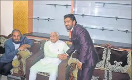  ??  ?? Haryana CM Manohar Lal Khattar being greeted by wrestler Yogeshwar Dutt at his village Bhainswal Kalan in Sonepat on Monday.