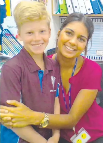  ??  ?? Gold Coast Year 8 student Aiden Barr, 13, with his Year 4 teacher Kiana Charlton.