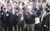  ?? CHRISTINNE MUSCHI ?? From left, Dave Stubbs, Geoff Molson, Mike Farber and Pat Hickey toast Red Fisher at the Bell Centre on Saturday.