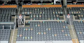  ??  ?? Bruins and Celtics gear demonstrat­es where fans will be sitting in the first game today.