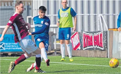  ??  ?? Lewis Milne scores against Stenhousem­uir, one of the 11 goals he notched for Montrose in the second half of last season.