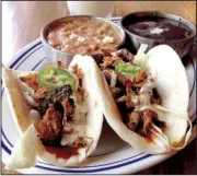  ?? Arkansas Democrat-Gazette/ERIC E. HARRISON ?? Heights Taco & Tamale Co., with its Pulled Pork Tacos with black and pinto beans, was perhaps the most highly anticipate­d 2015 restaurant opening.