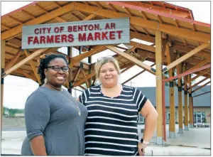  ?? SAM PIERCE/TRILAKES EDITION ?? Sarita Robinson, left, and Becca Hudson stand in front of the Farmers Market in downtown Benton. Robinson and Hudson are organizing a block party for Saturday with the proceeds benefiting ALS Associatio­n Arkansas Chapter.