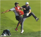  ?? Brad Horrigan / Hartford Courant ?? After Jordan Spieth holed his bunker shot to win the Travelers Championsh­ip, above, he and caddie Michael Greller (left) began jumping for joy.