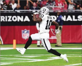  ?? Bay Area News Group/tns ?? Rico Gafford of the Oakland Raiders scores a receiving touchdown during the first quarter of an NFL preseason game against the Arizona Cardinals at State Farm Stadium on Thursday in Glendale, Arizona.