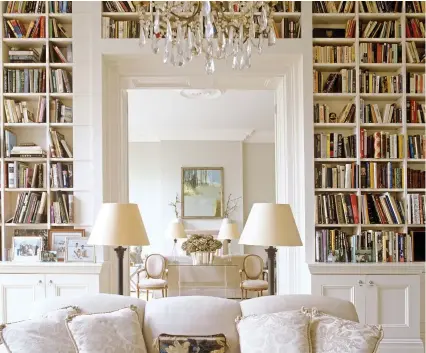  ?? Picture: GETTY ?? Shelf life: Books enhance the clean symmetrica­l design of this terraced home in London
