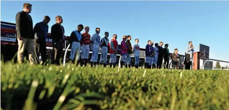  ??  ?? MOMENT TO REFLECT: Police chaplain Jeff Baills delivers his address as jockeys, staff and officials gather on the Clifford Park track before the start of the new racing season for National Jockey Celebratio­n Day. PHOTO: KEVIN FARMER