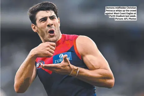  ?? ?? Demons midfielder Christian Petracca whips up the crowd against West Coast Eagles at Perth Stadium last week. Picture: AFL Photos