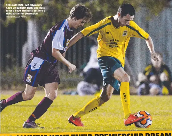  ?? Picture: WESLEY MONTS ?? STELLAR RUN: MA Olympic’s Cade Colquihoun ( left) and Ross River’s Beau Ticehurst get into a tight battle for possession.