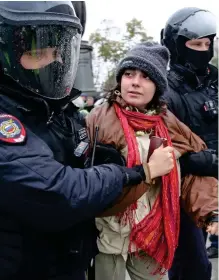  ?? ?? Brave: Another female protester is arrested