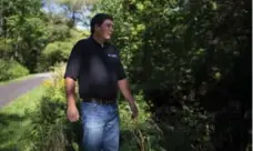  ??  ?? Scott Jarvie of the Toronto and Region Conservati­on Authority tours an inviting section of the Black Creek watershed, near Finch Ave. W.