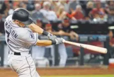  ?? Ralph Freso, The Associated Press ?? Rockies second baseman Garrett Hampson gets his first majorleagu­e hit — an RBI double against the Arizona Diamondbac­ks during the fifth inning on July 21.