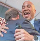  ??  ?? Sen. Cory Booker, D-N.J., hugs Democratic Senate candidate Doug Jones during a rally Sunday.
MICKEY WELSH/USA TODAY NETWORK