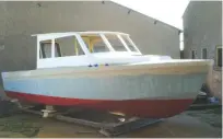  ??  ?? 1 The faired hull is moved out of the workshop ready for detailed sanding to achieve a good finish.