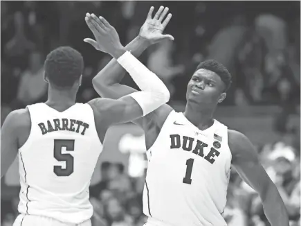  ?? ROB KINNAN/USA TODAY SPORTS ?? Freshman forwards Zion Williamson, who is averaging 20.2 points and 9.5 rebounds, and R.J. Barrett, who is averaging 22.9 points and 6.9 rebounds, have led Duke to a 12-1 record entering Tuesday.