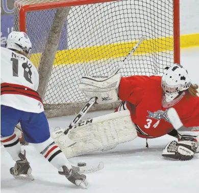  ?? HERALD PHOTO BY JOSEPH PREZIOSO ?? SOUTH STARS SHINE BRIGHEST: South goaltender Caroline McDonough (above) makes a stop on North’s Carolyn Curley, and South players mob Catherine Luciano (right), who scored the winning goal in overtime of yesterday’s girls Shriner’s All-Star game at...