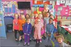  ?? 01_B24WB06 ?? Brightly attired to represent the 1980s, Mrs Sheila MacAlister and pupils pose for a P1/P2/P3 class photo.