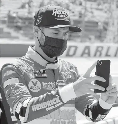  ??  ?? Kyle Larson, pictured on May 9 at Darlington Raceway, has formed a bond with Philadelph­ia’s Urban Youth Racing School.