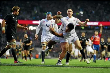  ?? GETTY IMAGES ?? Bottom left: England last beat the All Blacks on New Zealand soil in 2003, 15-13 in Wellington. Bottom right: Manu Tuilagi scores his try in England’s 38-21 win over the All Blacks in 2012.