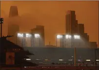  ?? NHAT V. MEYER — BAY AREA NEWS GROUP FILE ?? Smokey skies can be seen over Oracle Park before a Giants game against the Mariners in San Francisco on Sept. 9.