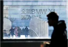  ??  ?? This file photo shows an advertisem­ent for German automaker BMW on the building of a BMW store. German luxury carmaker BMW announced a plan to take control of its China joint-venture, the first foreign automaker to take advantage of Beijing’s new ownership rules for the sector. — AFP photo