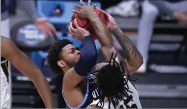  ?? MICHAEL CONROY - THE ASSOCIATED PRESS ?? Baylor’s Davion Mitchell (45) blocks a shot attempt by Villanova’s Justin Moore in the second half of a Sweet 16game of the NCAA Men’s Tournament Saturday at Hinkle Fieldhouse in Indianapol­is.