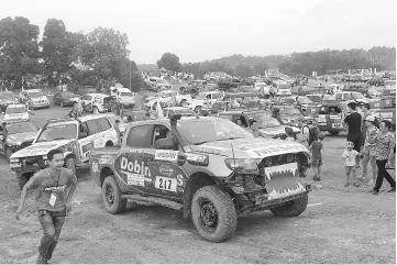  ??  ?? This picture taken on September 9, 2017 shows vehicles taking part in the Vietnam Offroad 2017 race on the outskirts of Hanoi. The sport of off-road racing has taken off in Vietnam, where driving addicts say they can get a safe rush -- unlike drug...