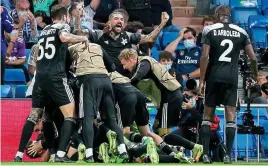  ?? GETTY IMAGES ?? Real shock: Sheriff celebrate a famous win in Madrid