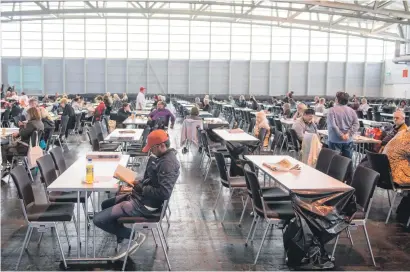  ?? Picture: AFP ?? SHELTER. People wait in an exhibition hall serving as a shelter as evacuation­s are under way in Frankfurt am Main, western Germany, yesterday.