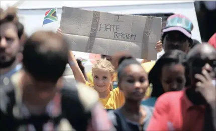  ?? PICTURE: MOTSHWARI MOFOKENG ?? YOUNG ACTIVIST: Gillian Webber, 10, displays her feelings at an anti-racism march in Scottburgh, KZN.