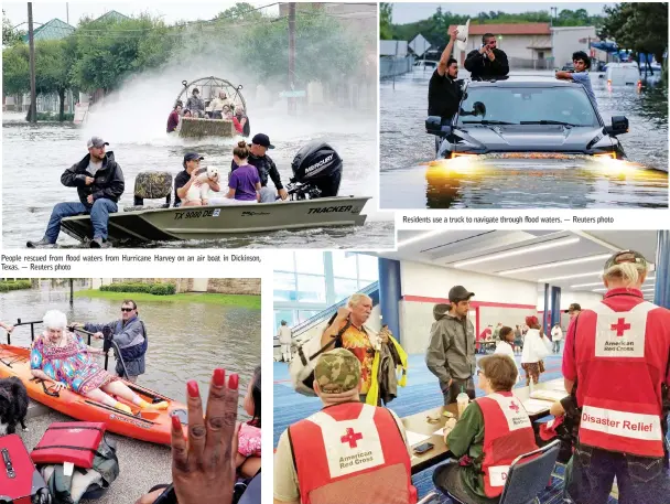  ??  ?? People rescued from flood waters from Hurricane Harvey on an air boat in Dickinson, Texas. — Reuters photo Residents use a truck to navigate through flood waters. — Reuters photo Evacuees arrive to seek shelter with Red Cross volunteers at the George...
