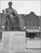  ??  ?? A statue of Abraham Lincoln greets visitors in front of the Lincoln Museum in Hodgenvill­e, Ky.