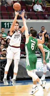  ?? ALVIN S. GO ?? THE UP FIGHTING MAROONS are back in the UAAP Final Four after 21 years following their 97-81 victory over the De La Salle Green Archers in their allimporta­nt match on Wednesday.