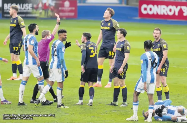  ??  ?? Stoke’s Rhys Norrington-davies is sent off at Huddersfie­ld on Saturday.