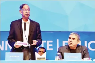  ??  ?? Indian non-executive Chairman of the Board and Independen­t Director of Infosys R. Seshasayee (left), addresses share holders while CEO Vishal Sikka looks on at the start of the 36th Annual General Meeting of Infosys in
Bangalore on June 24. (AFP)