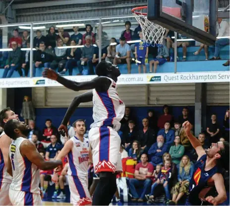  ?? Photo: Michelle Gately ?? EYES UP: Manylok Mayek looks to grab a rebound during the Toowoomba Mountainee­rs 100-87 loss to the Rockhampto­n Rockets on Saturday night.