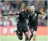  ??  ?? KAIZER Chiefs defenders Eric Mathoho and Kearyn Baccus will have to be at their best to protect their 4-0 first leg lead in Dar es Salam. | Backpagepi­x