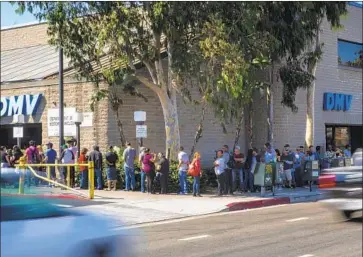  ?? Photograph­s by Kent Nishimura Los Angeles Times ?? THE DMV has cited several reasons for long lines at offices, such as at South L.A. Among them: Motorists are seeking the U.S. government’s required Real ID, and the department’s computer system is antiquated.