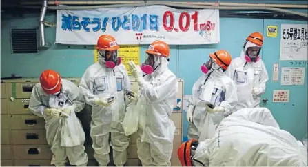  ?? Photo: REUTERS ?? Nuclear nightmare: Staff and media get ready to inspect the Fukushima Daiichi nuclear power plant this month – three years after it was crippled by the 2011 tsunami that triggered the world’s worst nuclear crisis since Chernobyl.