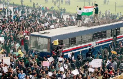  ?? PTI file ?? Protesters atop a police bus during a demonstrat­ion in New Delhi on Dec 22, 2012 to demand justice for Nirbhaya. —